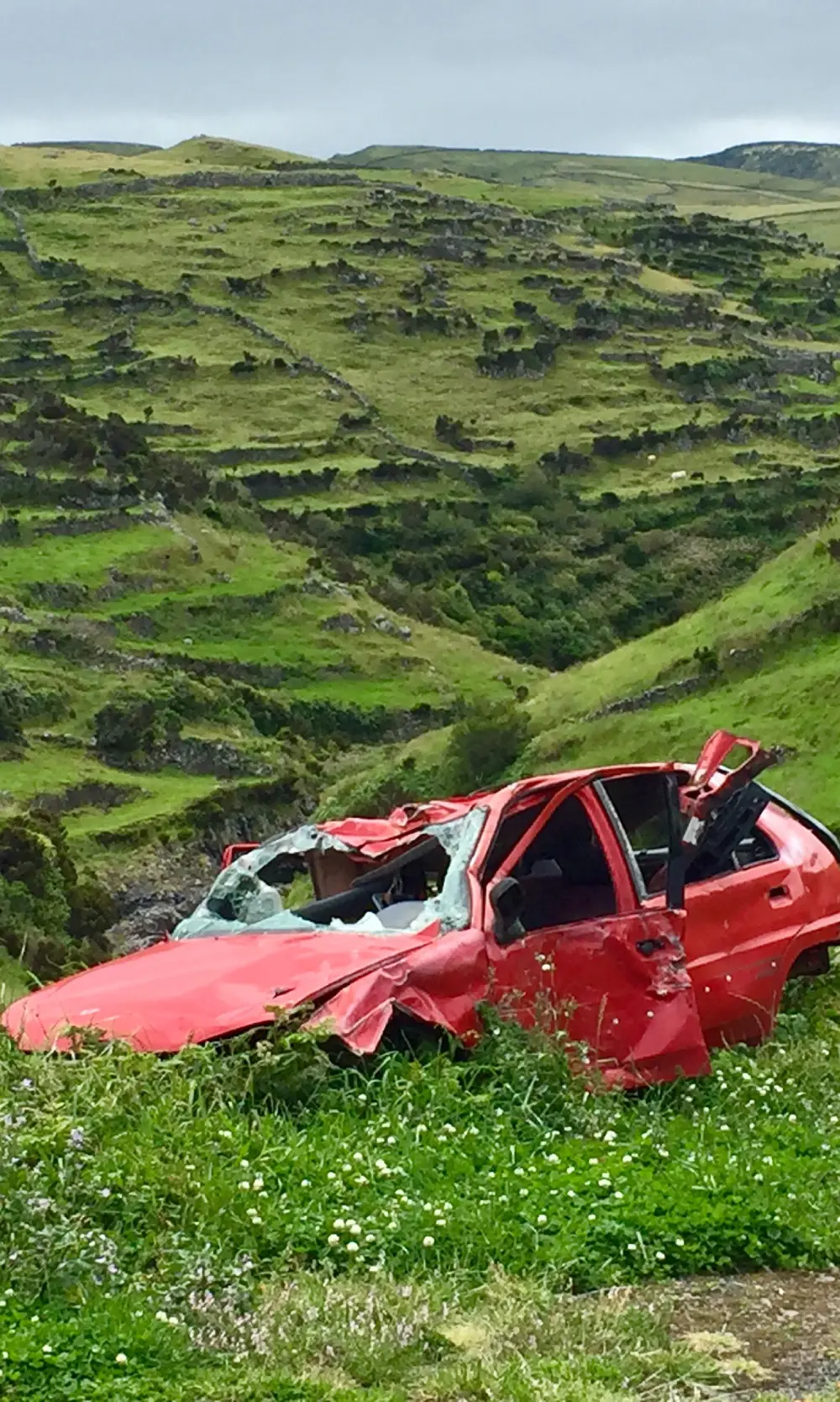 a broken red car